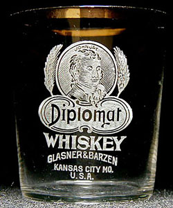 A rare John Jay Diplomat Whiskey shot glass, from Glazner & Barzen of Kansas City, MO.